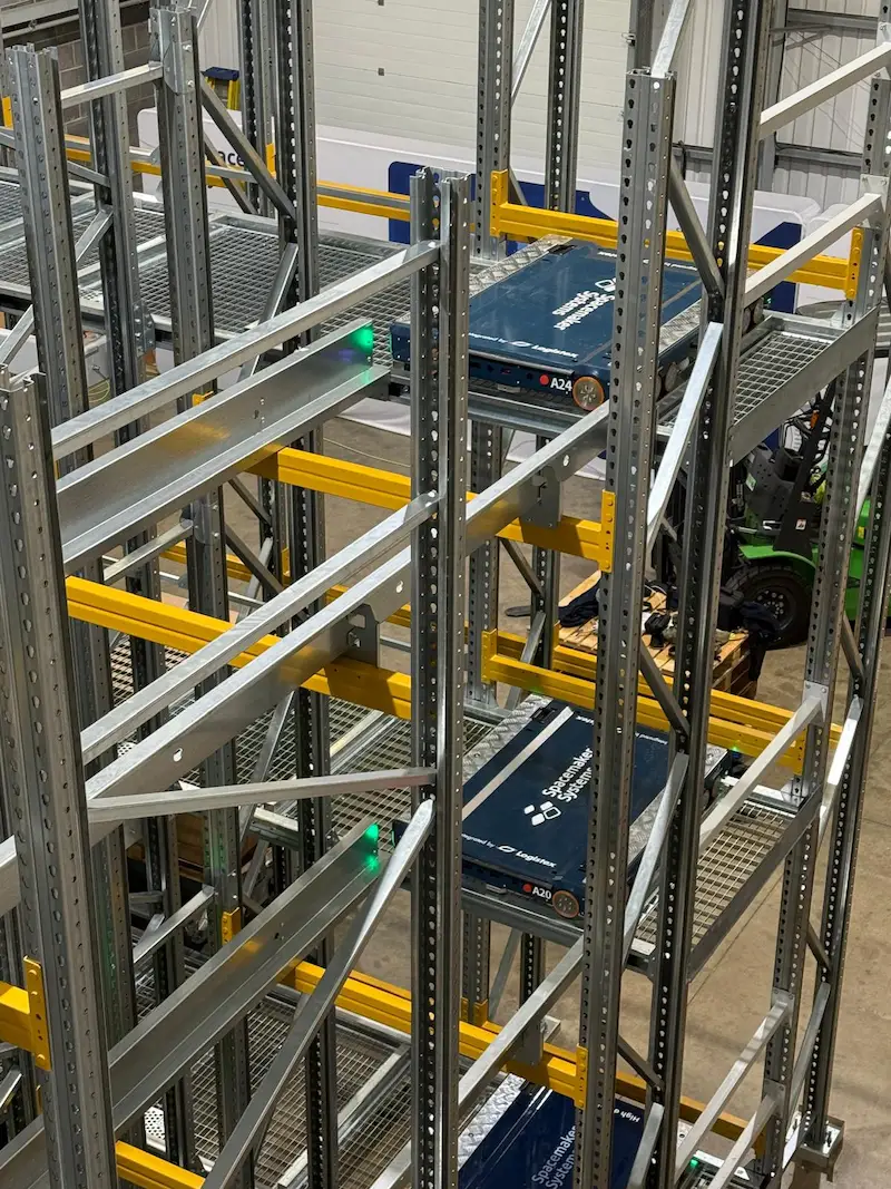 Spacemaker QuadAxis Pro four-way pallet shuttle in a warehouse